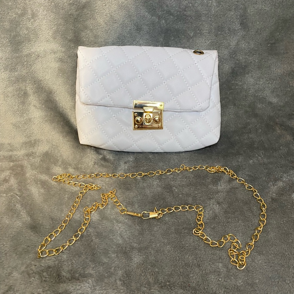 While purse with twistable lock and detachable gold chain.